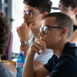 Student attentively follows the summer course on artificial intelligence organized by Politecnico di Milano for high school students.