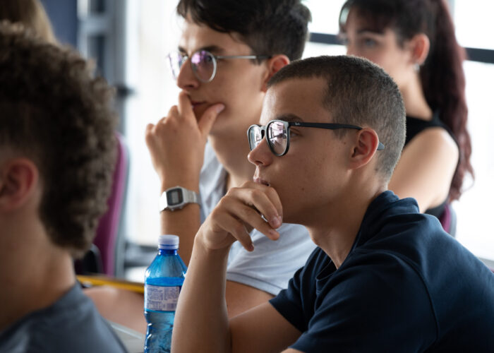 Student attentively follows the summer course on artificial intelligence organized by Politecnico di Milano for high school students.